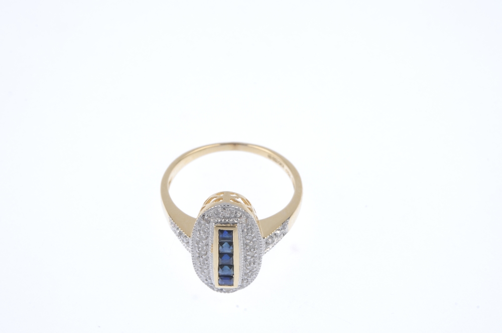 An 18ct gold sapphire and diamond ring. The square-shape sapphire line, within a channel setting, to - Image 2 of 4