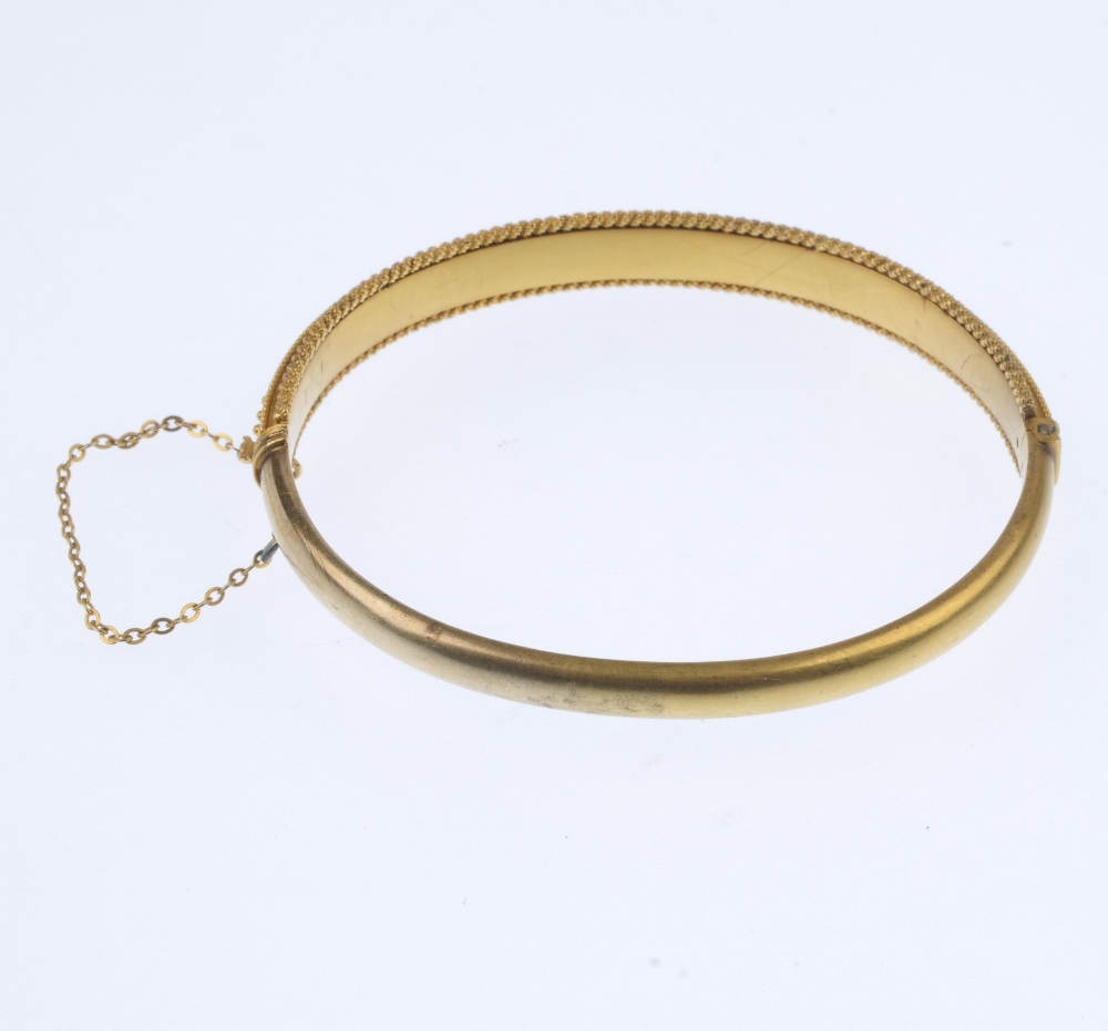A late 19th century gold split pearl hinged bangle. The split pearl line, to the bead accent sides - Image 3 of 4