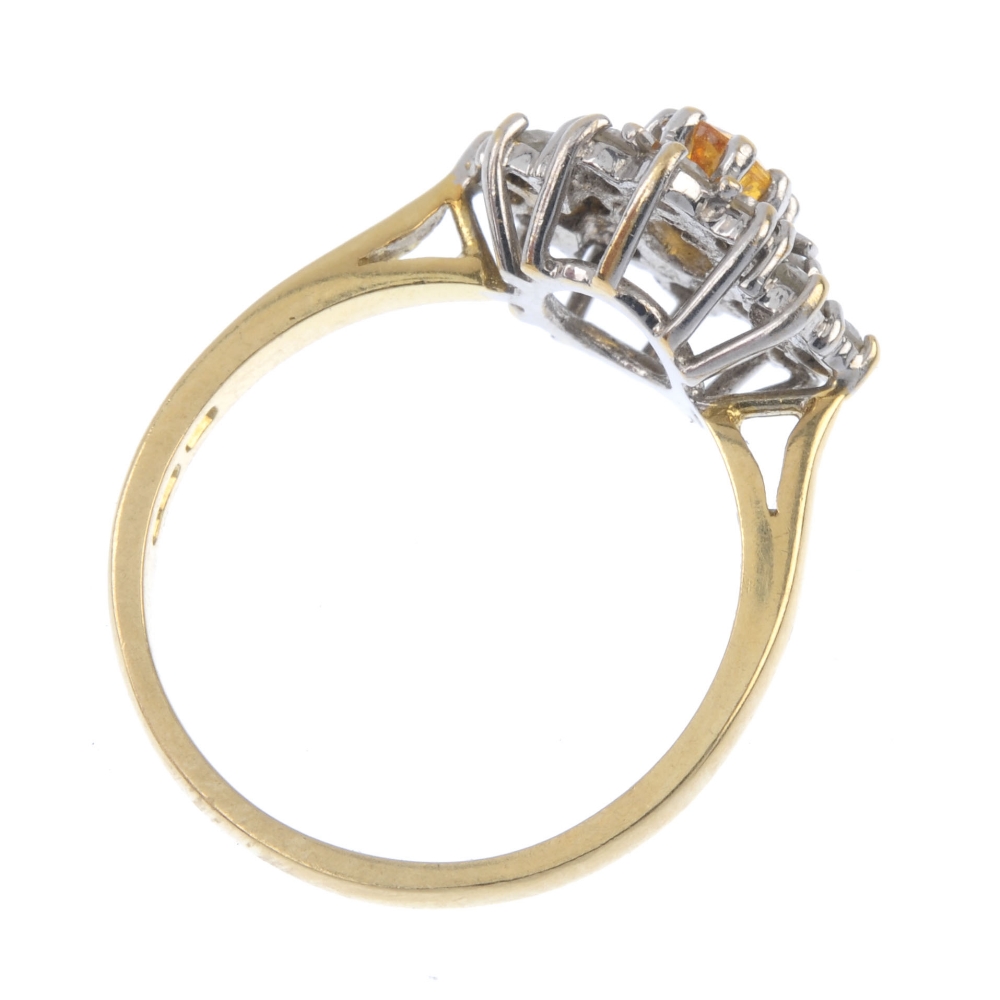 An 18ct gold sapphire and diamond cluster ring. The oval-shape orange sapphire, within an - Image 4 of 4