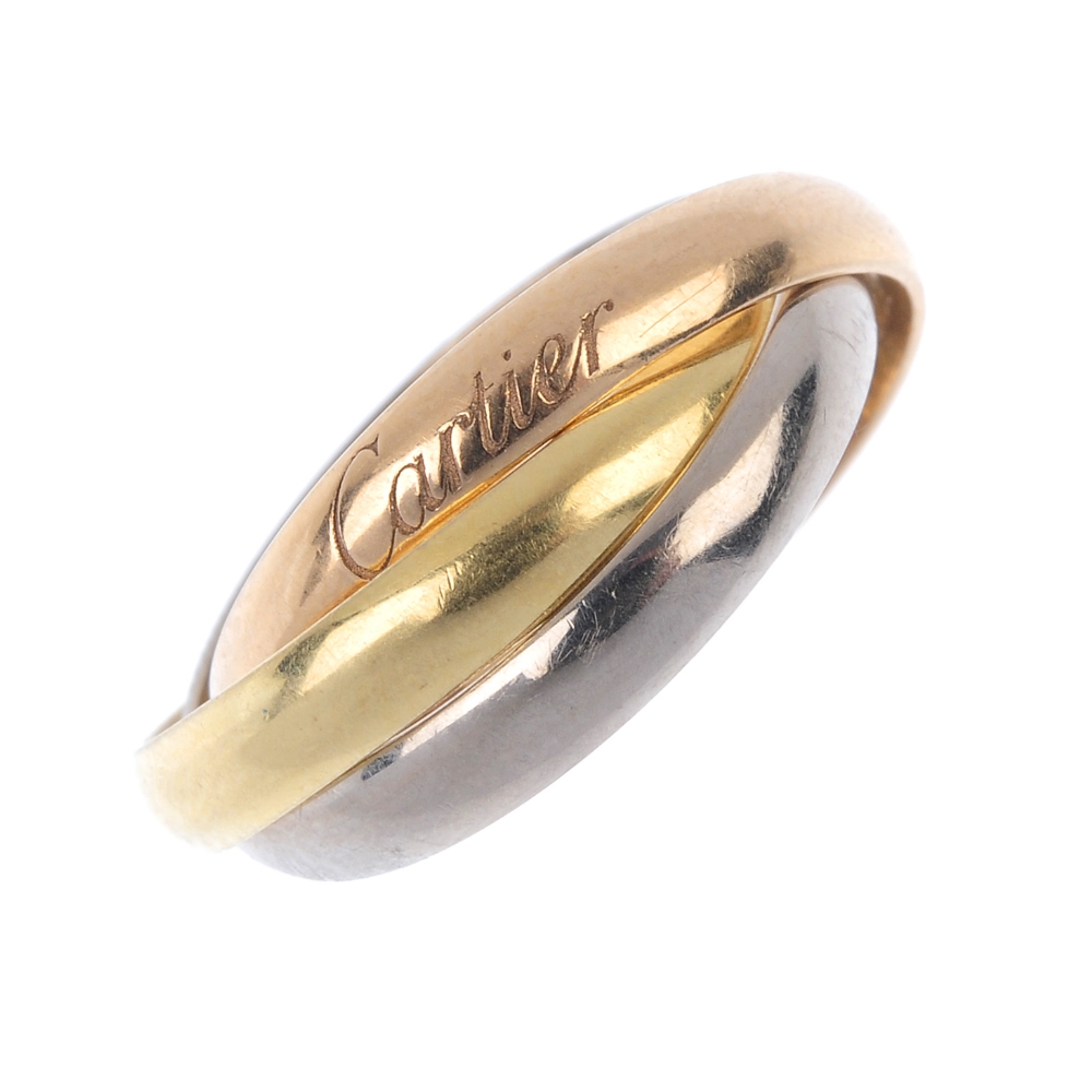 CARTIER - an 18ct gold 'Trinity' ring. Of tri-colour design, comprising three interwoven bands.