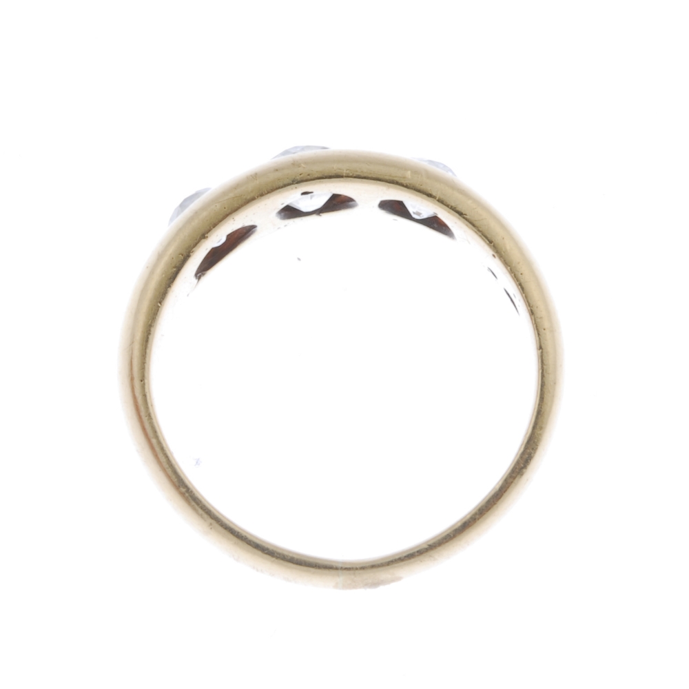A late 19th century 18ct gold diamond three-stone ring. The slightly graduated old-cut diamond line, - Image 4 of 4