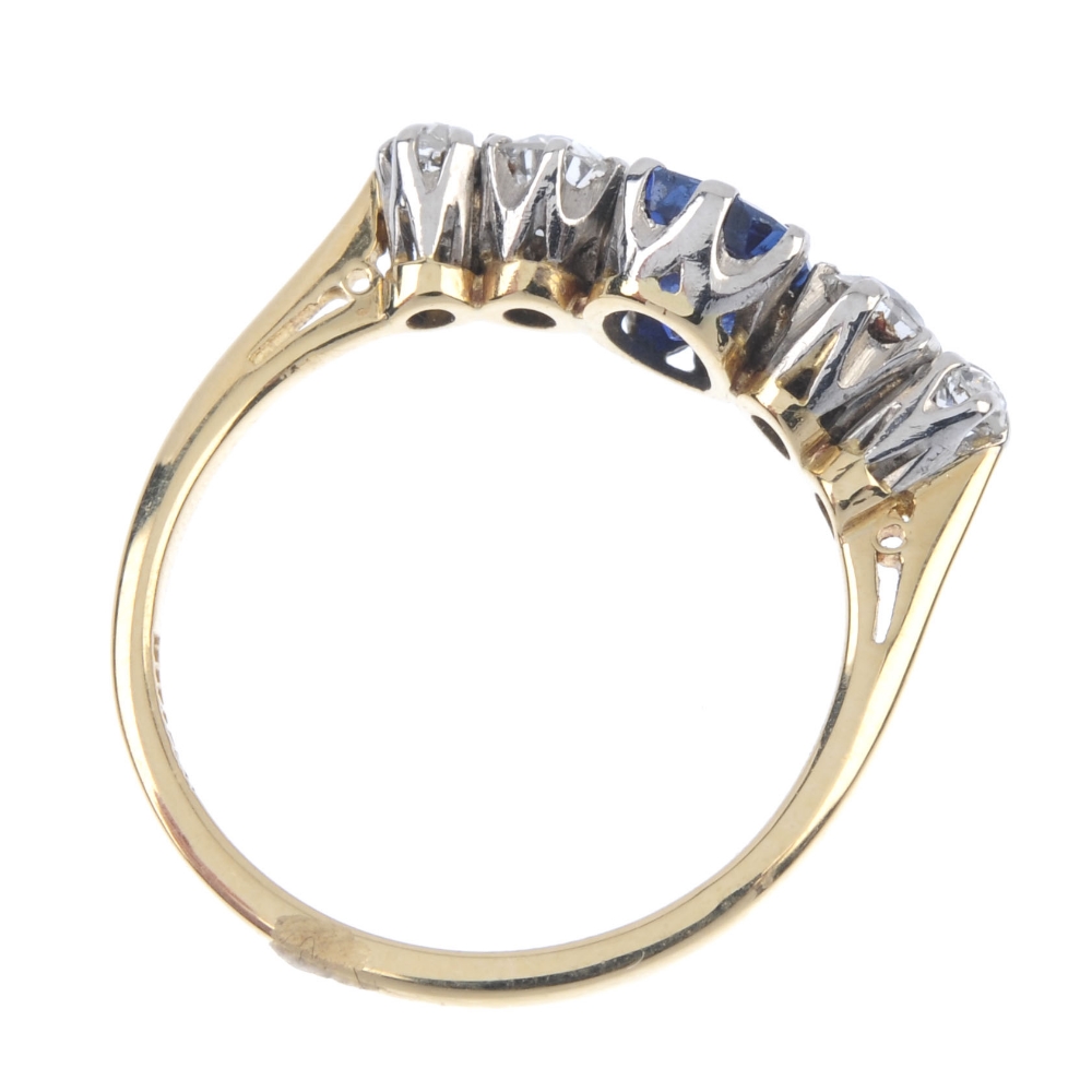 An 18ct gold sapphire and diamond five-stone ring. The oval-shape sapphire, with graduated old-cut - Image 4 of 4