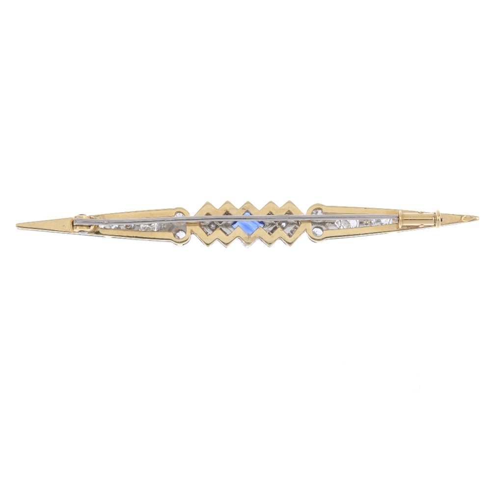 A sapphire and diamond bar brooch. The square-shape sapphire, to the single-cut diamond chevrons and - Image 2 of 2