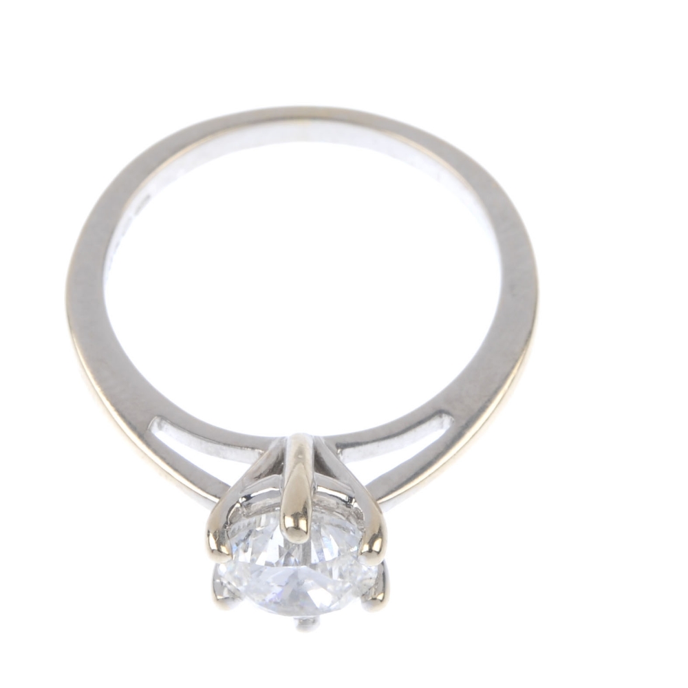 An 18ct gold diamond single-stone ring. The brilliant-cut diamond, to the tapered shoulders and - Image 2 of 4