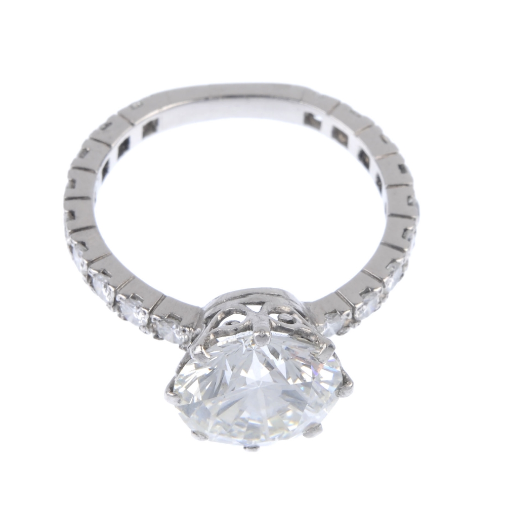 A diamond single-stone ring. The brilliant-cut diamond, weighing 4.69cts, to the similarly-cut - Image 2 of 5