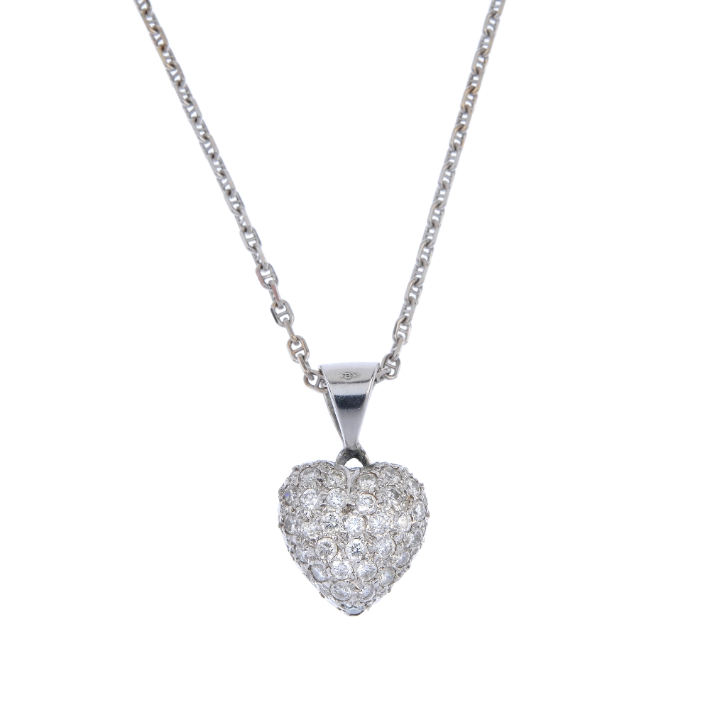 A diamond heart pendant. The pave-set brilliant-cut diamond heart, to the tapered surmount,