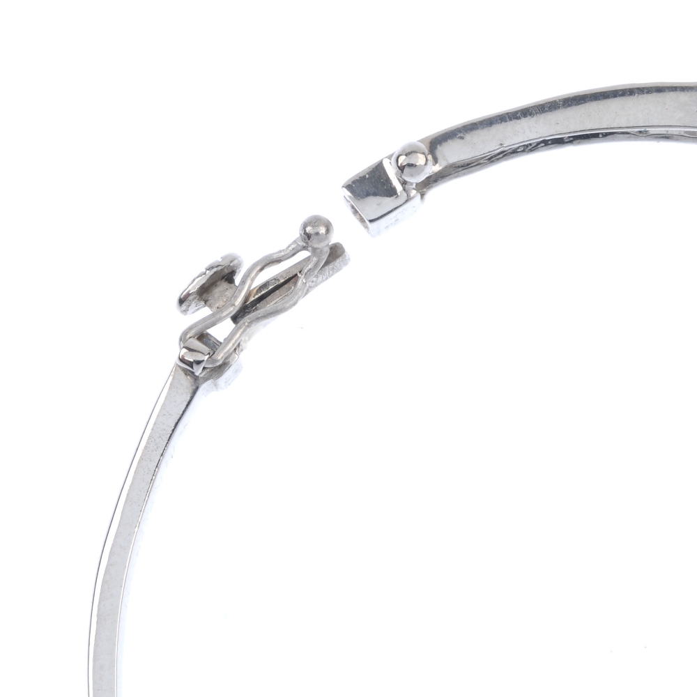 A 14ct gold diamond hinged bangle. The front designed as a series of brilliant-cut diamond graduated - Image 3 of 3