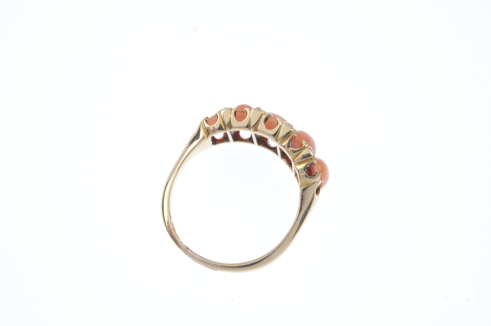 An early 20th century gold coral and diamond five-stone ring. Designed as a series of graduated oval - Image 4 of 4