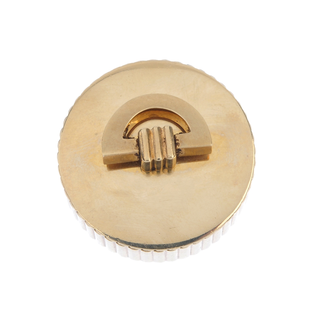 CARTIER - a 1940s 9ct gold pill box. Of circular outline, the grooved sides and slightly domed base,