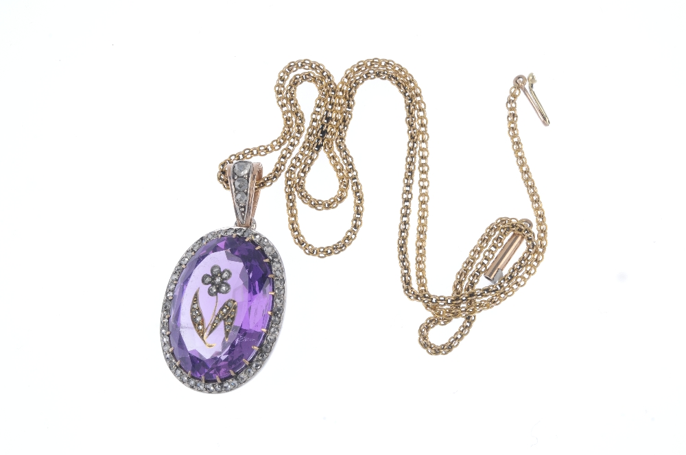 An early 20th century silver and gold, amethyst and diamond pendant. The oval-shape amethyst with - Image 4 of 4