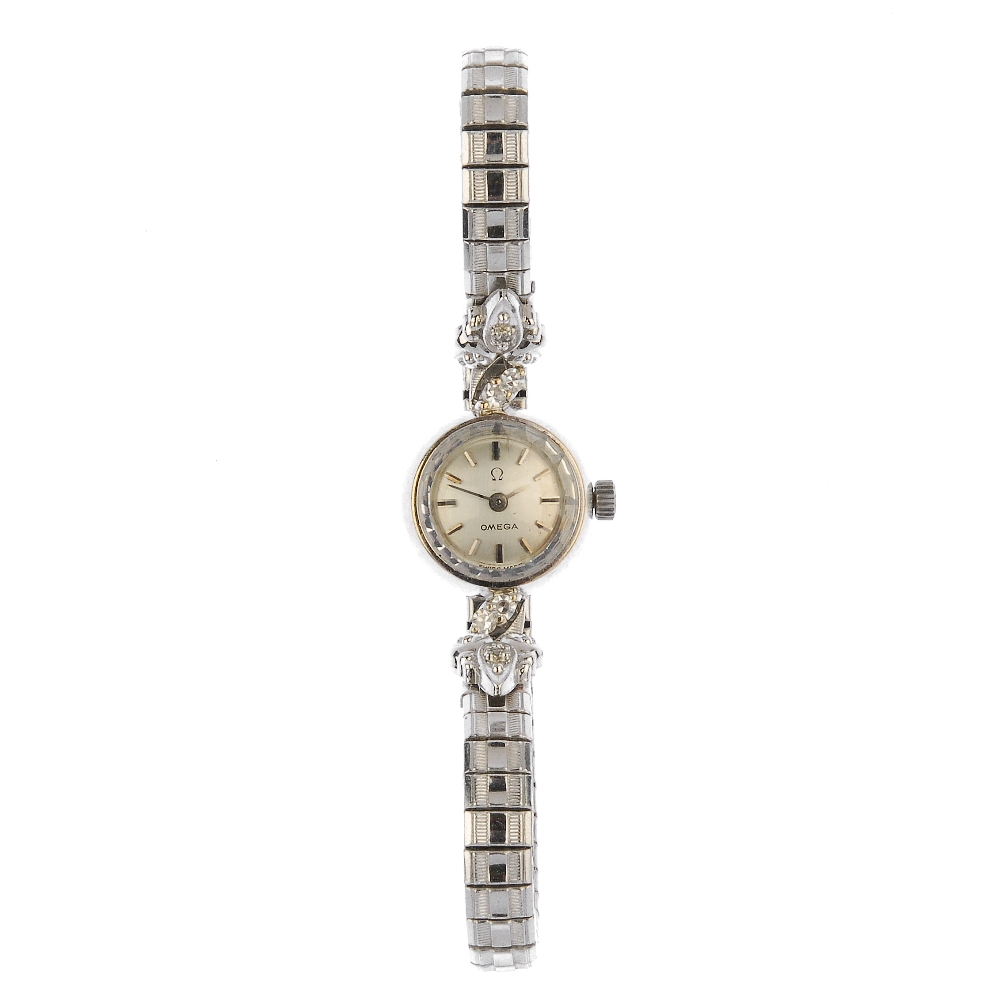 OMEGA - a lady's diamond manual wind watch. The circular-shape grey dial, with baton markers and