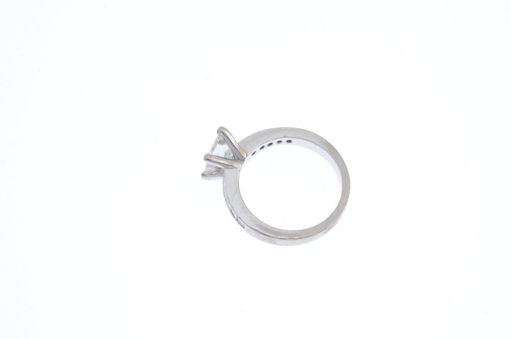 An 18ct gold diamond single-stone ring. The square-shape diamond, between similarly-cut diamond - Image 3 of 4