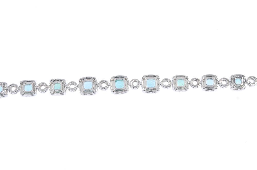 * An emerald and diamond cluster bracelet. Designed as a series of graduated cushion-shape emeralds, - Image 2 of 3