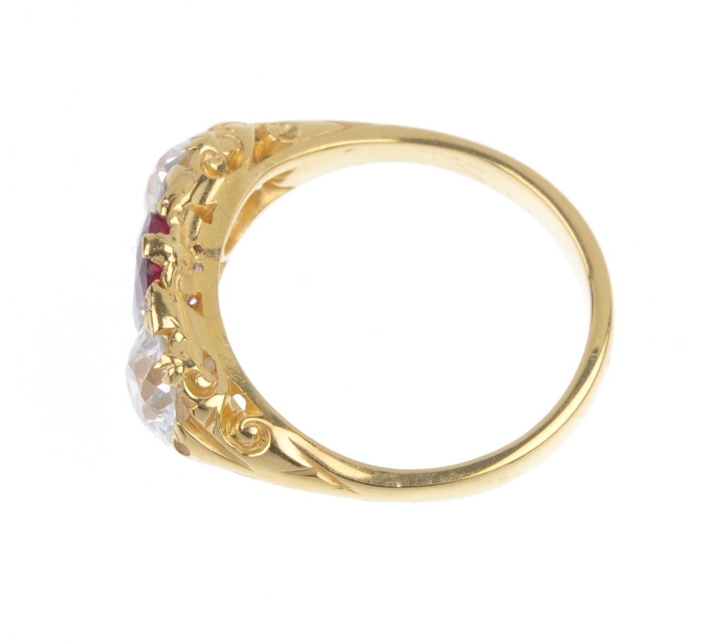 A ruby and diamond three-stone ring. The rectangular-shape ruby and old-cut diamond line, with - Image 3 of 4