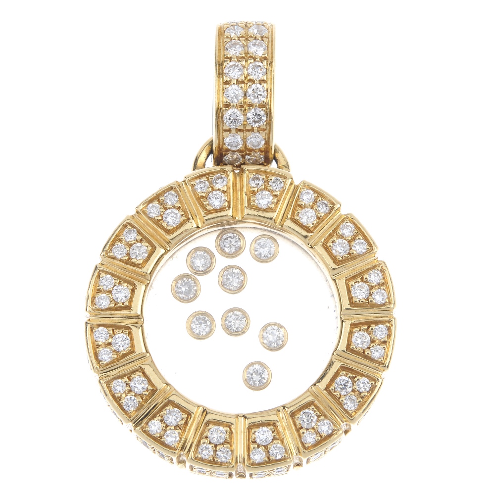 An 18ct gold diamond pendant. Designed as nine free-moving brilliant-cut diamond collets, within a