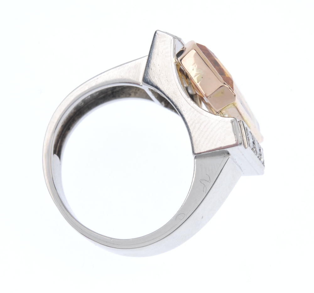 A topaz and diamond dress ring. The rectangular-shape golden topaz collet, to the brilliant-cut - Image 4 of 4