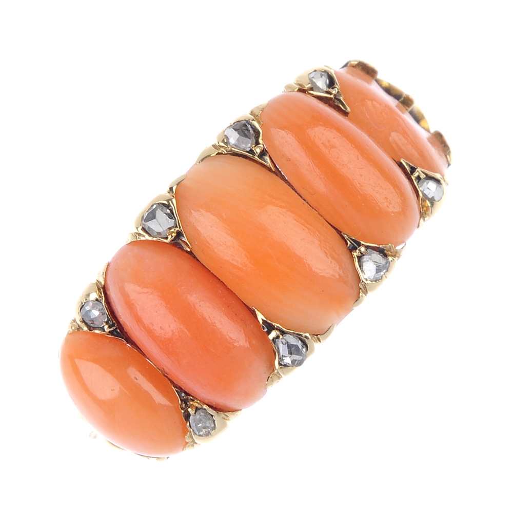 An early 20th century gold coral and diamond five-stone ring. Designed as a series of graduated oval