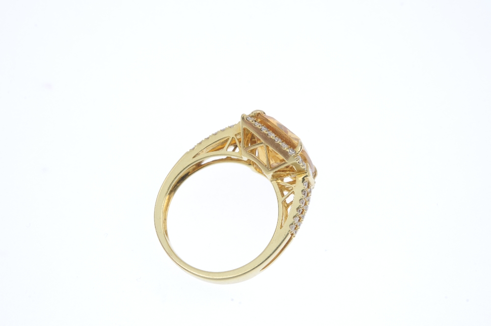 A citrine and diamond dress ring. The rectangular-shape citrine, within a brilliant-cut diamond - Image 4 of 4