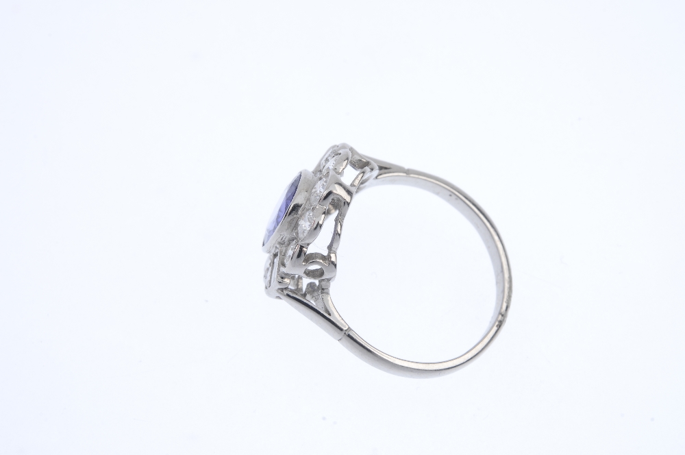 A tanzanite and diamond cluster ring. The oval-shape tanzanite collet, within a brilliant-cut - Image 3 of 4
