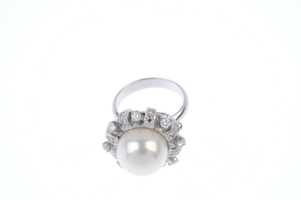 A cultured pearl and and diamond dress ring. The cultured pearl, measuring 12.1mms, within a - Image 2 of 4