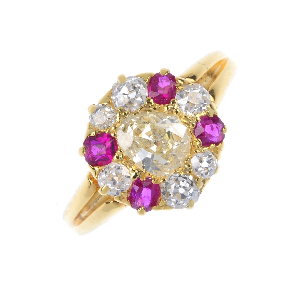 A diamond and ruby dress ring. The old-cut diamond, within a similarly-cut diamond and vari-shape