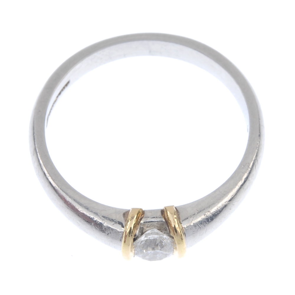 A platinum diamond single-stone ring. Of bi-colour design, the brilliant-cut diamond, with raised - Image 2 of 4