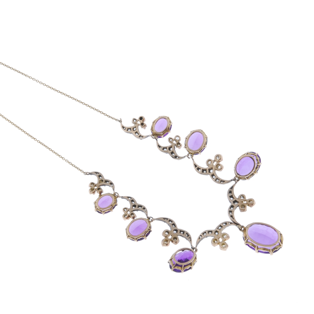 An amethyst and diamond necklace. The graduated oval-shape amethyst fringe, with similarly graduated - Image 2 of 4