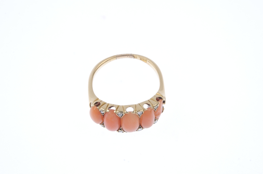 An early 20th century gold coral and diamond five-stone ring. Designed as a series of graduated oval - Image 2 of 4