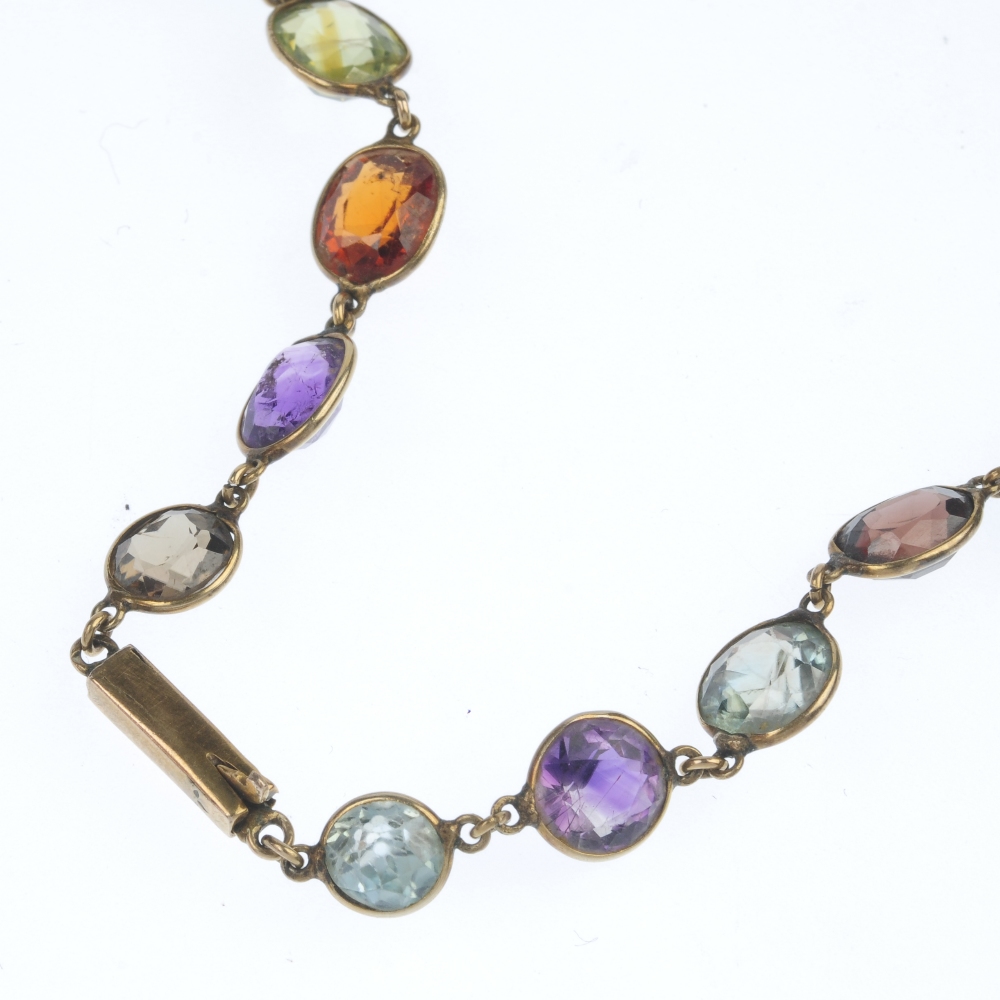 A multi gem-set necklace. The graduated vari-shape gem-set line, consisting of vari-hue zircon, - Image 2 of 3