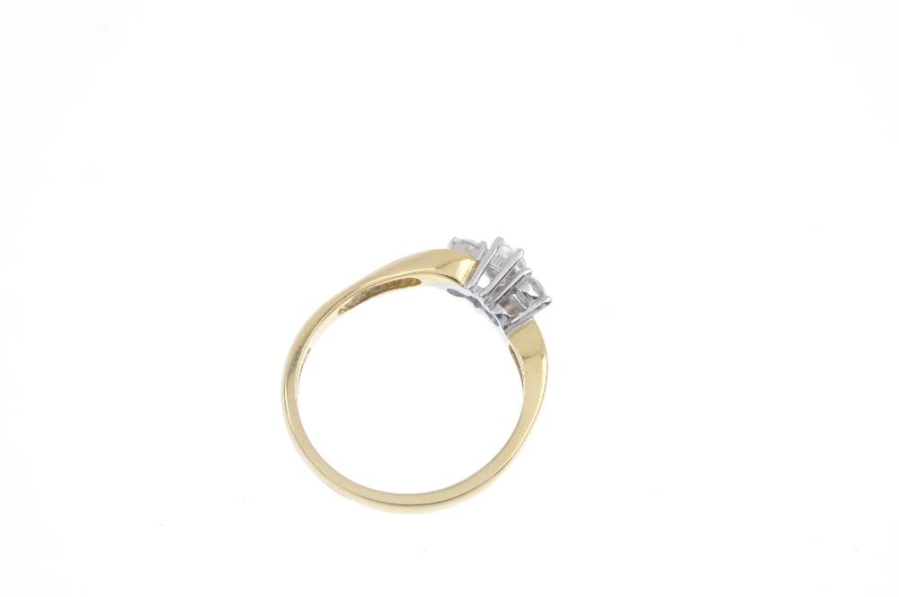 An 18ct gold diamond three-stone ring. The pear-shape diamond, to the brilliant-cut diamond - Image 4 of 4