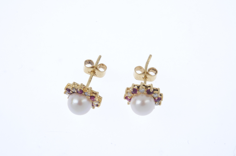 A pair of 18ct gold cultured pearl, ruby and diamond ear studs. Each designed as a cultured pearl, - Image 2 of 2