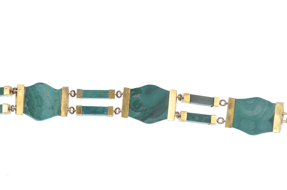 A late Victorian gold malachite bracelet, circa 1880. Designed as a series of curved malachite - Image 2 of 3