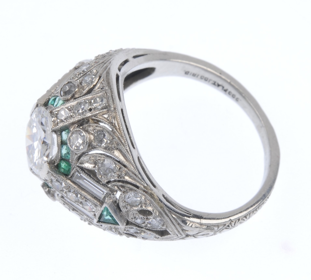 A diamond and emerald dress ring. Of geometric design, the circular-cut diamond, within a calibre- - Image 3 of 4