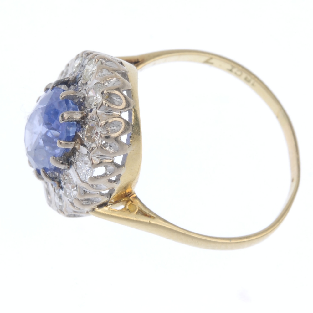 A mid 20th century 18ct gold sapphire and diamond cluster ring. The oval-shape sapphire, within a - Image 3 of 4