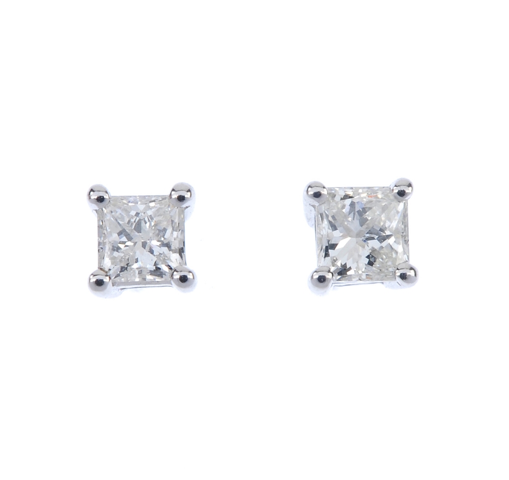 A pair of 18ct gold square-shape diamond single-stone ear studs. Total diamond weight 0.33ct,