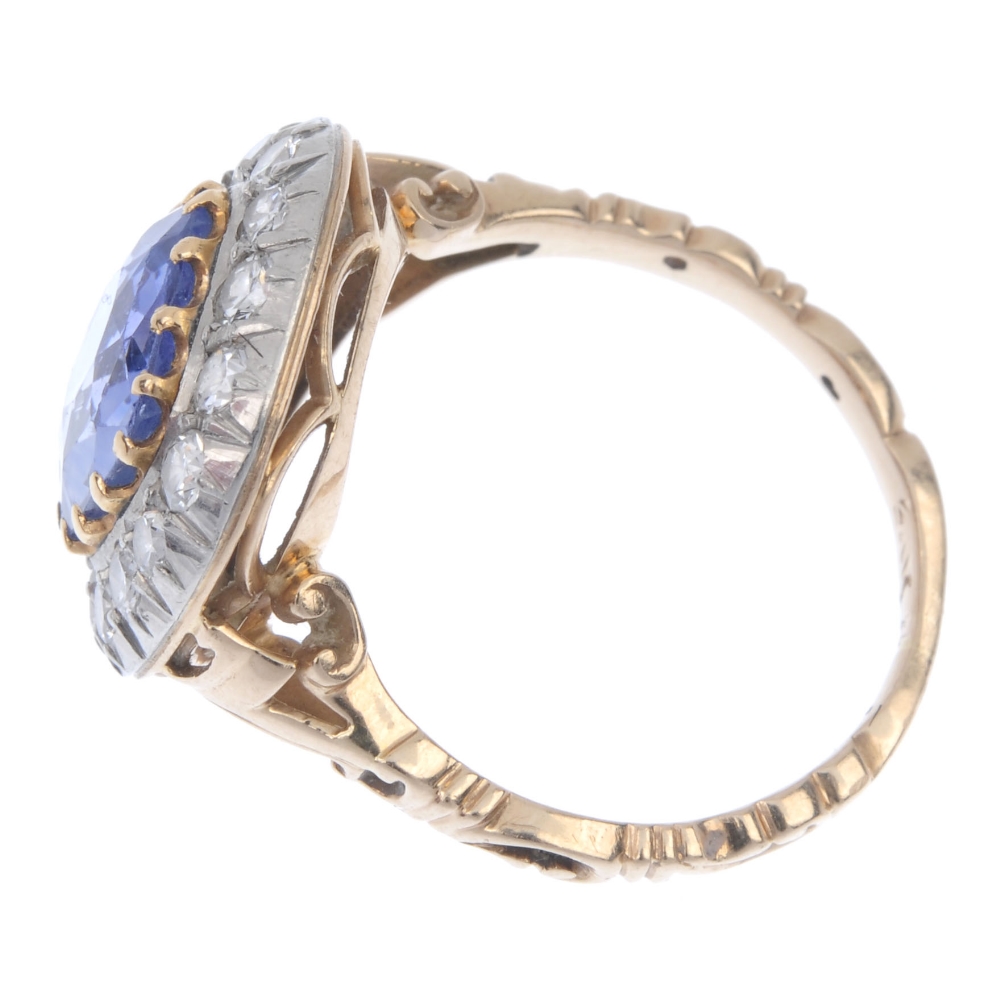 An early 20th century gold and silver sapphire and diamond cluster ring. The cushion-shape sapphire, - Image 3 of 5