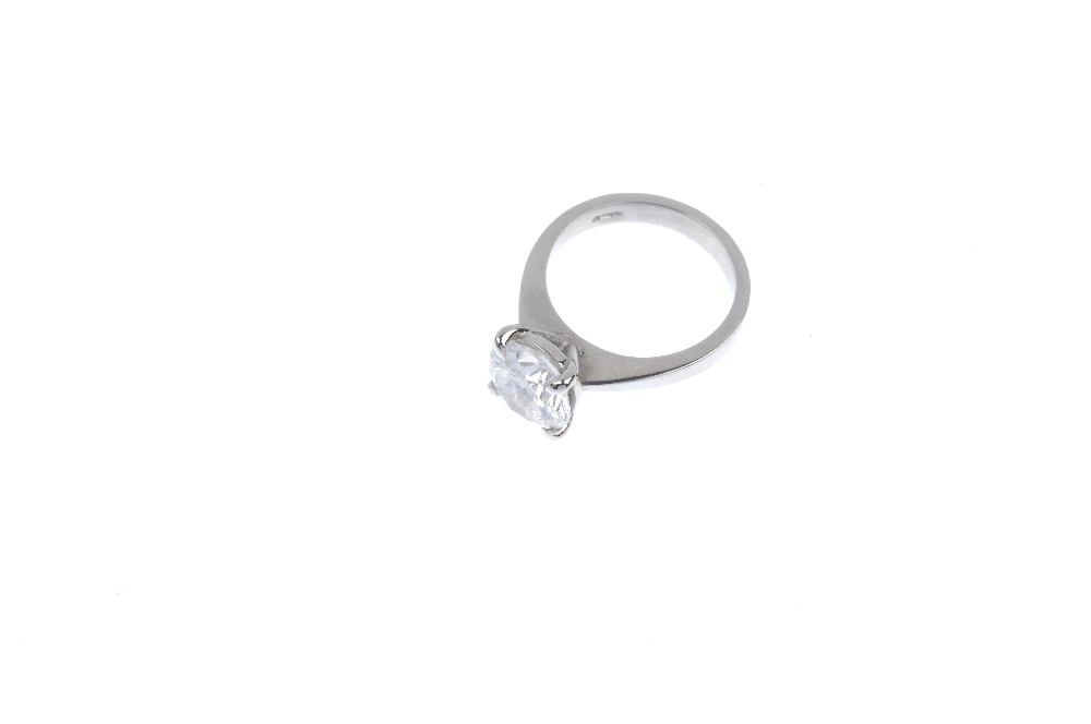 An 18ct gold diamond single-stone ring. The brilliant-cut diamond, weighing 3.02cts, to the plain - Image 2 of 4