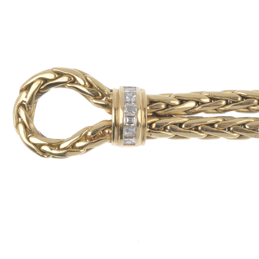 An 18ct gold diamond and gem-set bracelet. The looped rope-twist chain, with calibre-cut sapphire, - Image 2 of 5