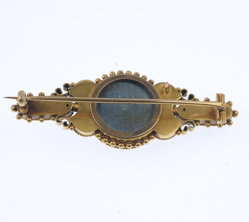 A late 19th century gold brooch. The floral centre, within a cannetille surround, to the similarly- - Image 2 of 2