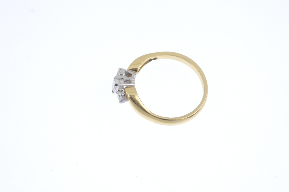 An 18ct gold diamond three-stone ring. The pear-shape diamond, to the brilliant-cut diamond - Image 3 of 4