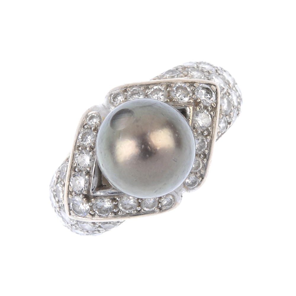 A cultured pearl and diamond dress ring. The grey cultured pearl, measuring approximately 10mms,