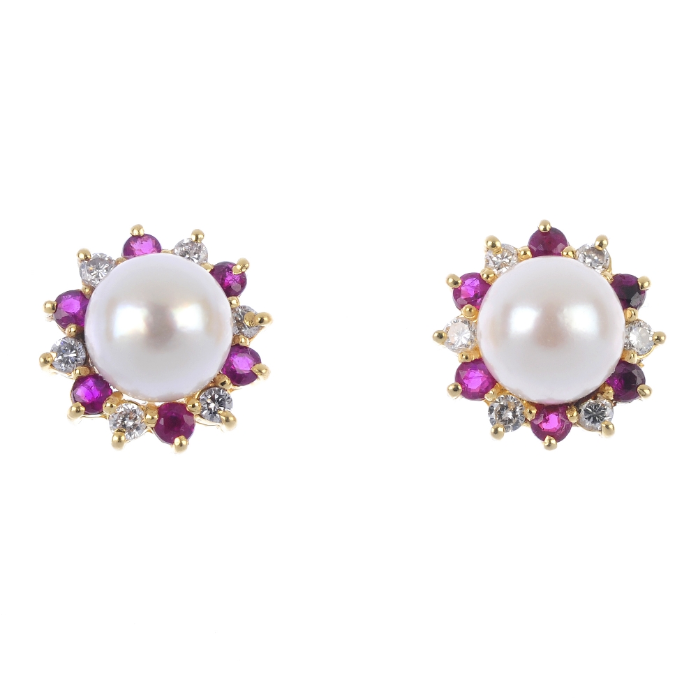 A pair of 18ct gold cultured pearl, ruby and diamond ear studs. Each designed as a cultured pearl,