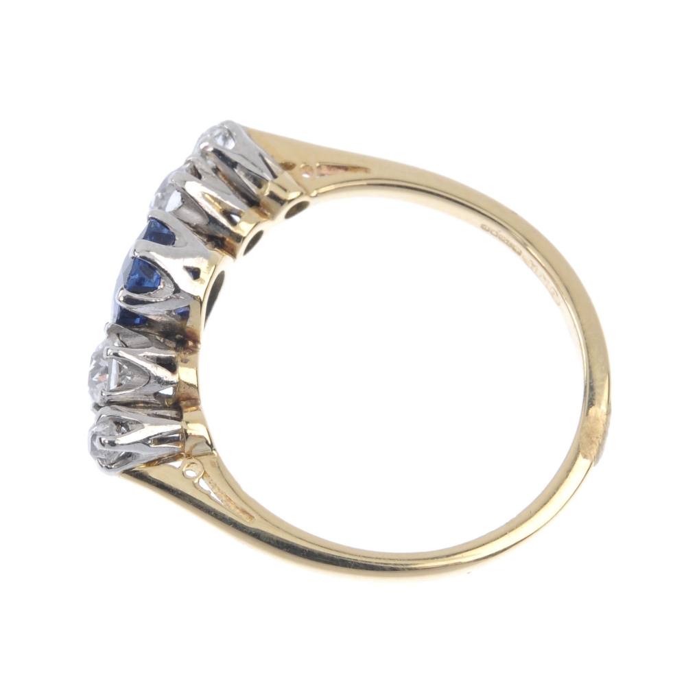 An 18ct gold sapphire and diamond five-stone ring. The oval-shape sapphire, with graduated old-cut - Image 3 of 4
