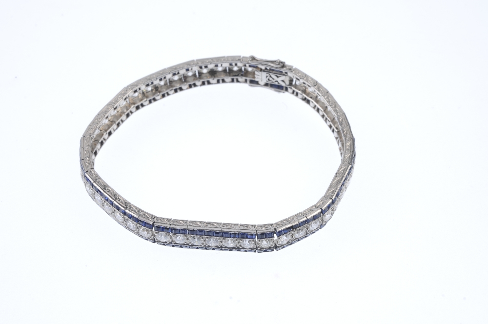 A mid 20th century diamond and sapphire bracelet. The circular-cut diamond line, with calibre-cut - Image 4 of 5