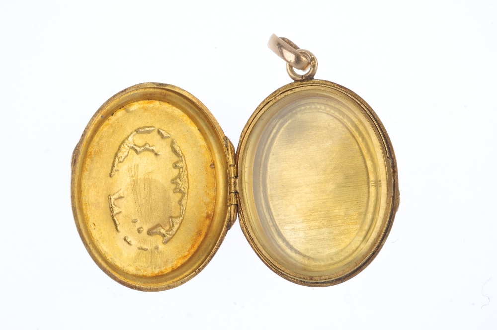 A mid 19th century 18ct gold floral locket. Of oval outline, the raised and chased tri-colour floral - Image 2 of 3