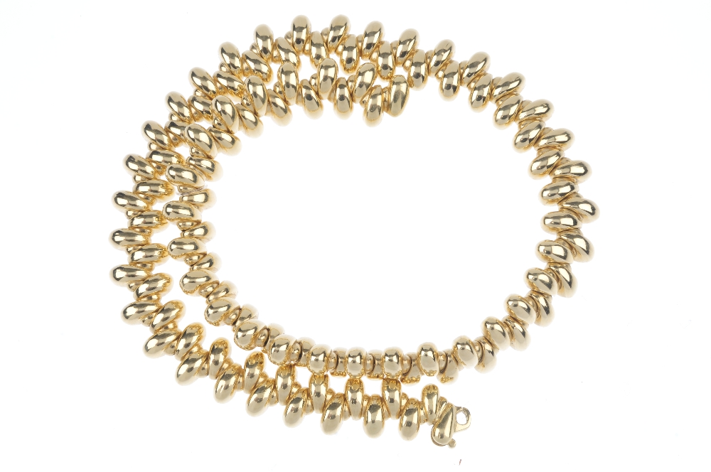 An 18ct gold collar. Designed as a series of tapered links, set at alternating orientations, to - Image 2 of 3