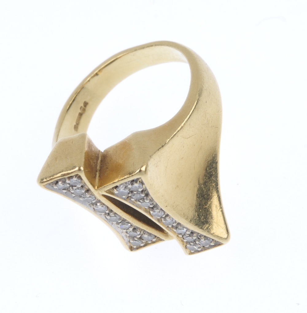 An 18ct gold diamond dress ring. Of asymmetric design, the staggered tapered panels, set with - Image 2 of 4