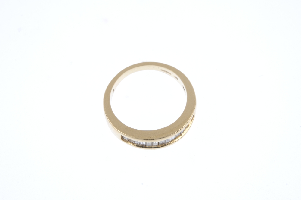 An 18ct gold diamond half-circle eternity ring. The baguette-cut diamond line, inset to the - Image 2 of 4