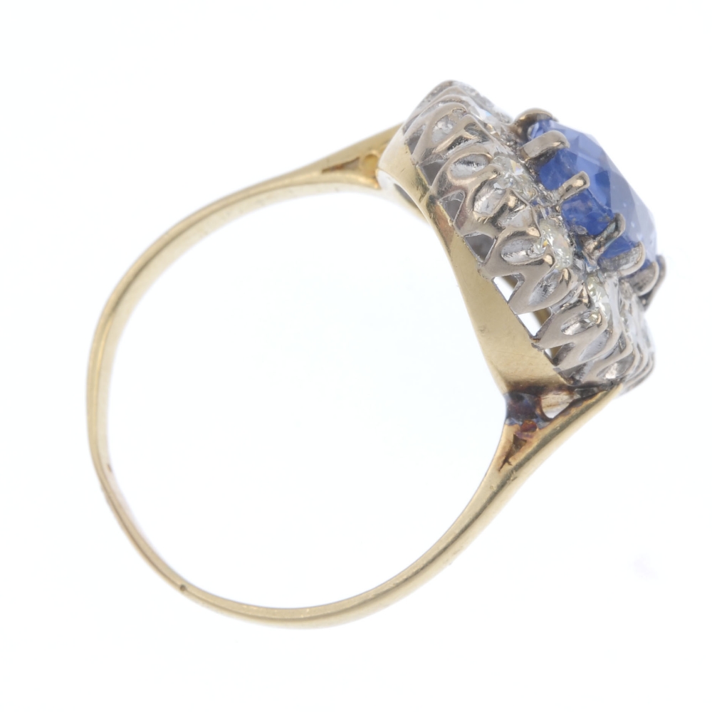 A mid 20th century 18ct gold sapphire and diamond cluster ring. The oval-shape sapphire, within a - Image 4 of 4