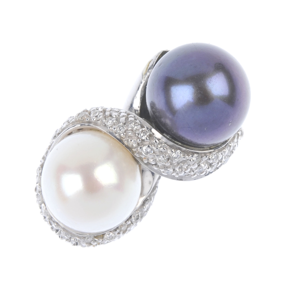 A cultured pearl and diamond dress ring. The black and cream cultured pearls, within a pave-set